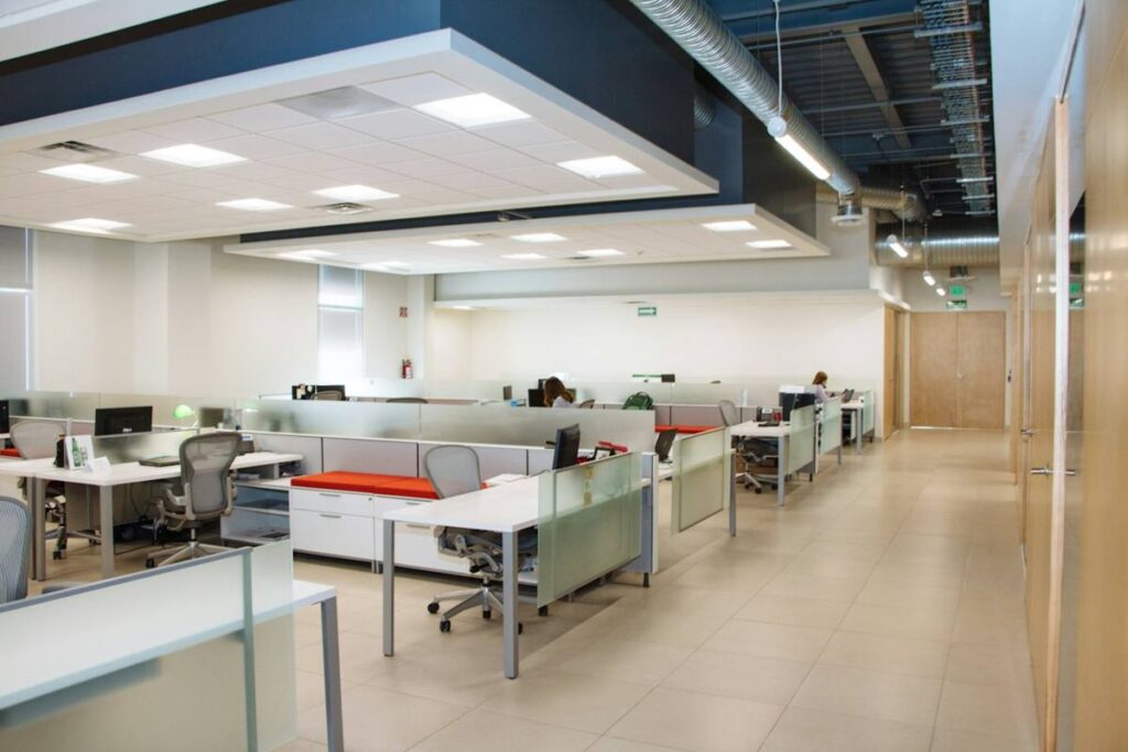 Modern open-plan office with white desks